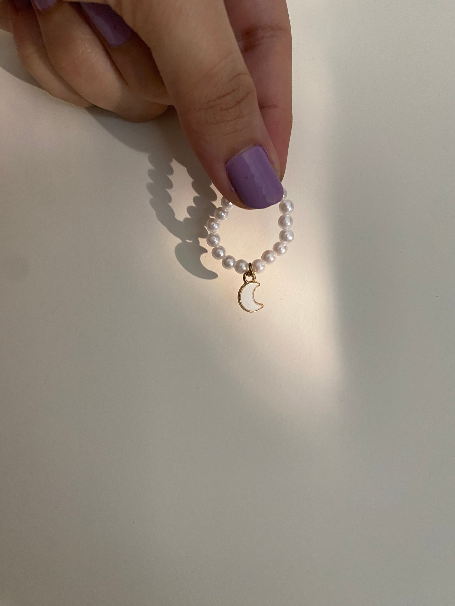 CRESCENT MOON HANGING ON PEARLS - RING