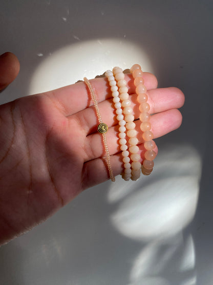 NUDE STACK OF FOUR BRACELETS