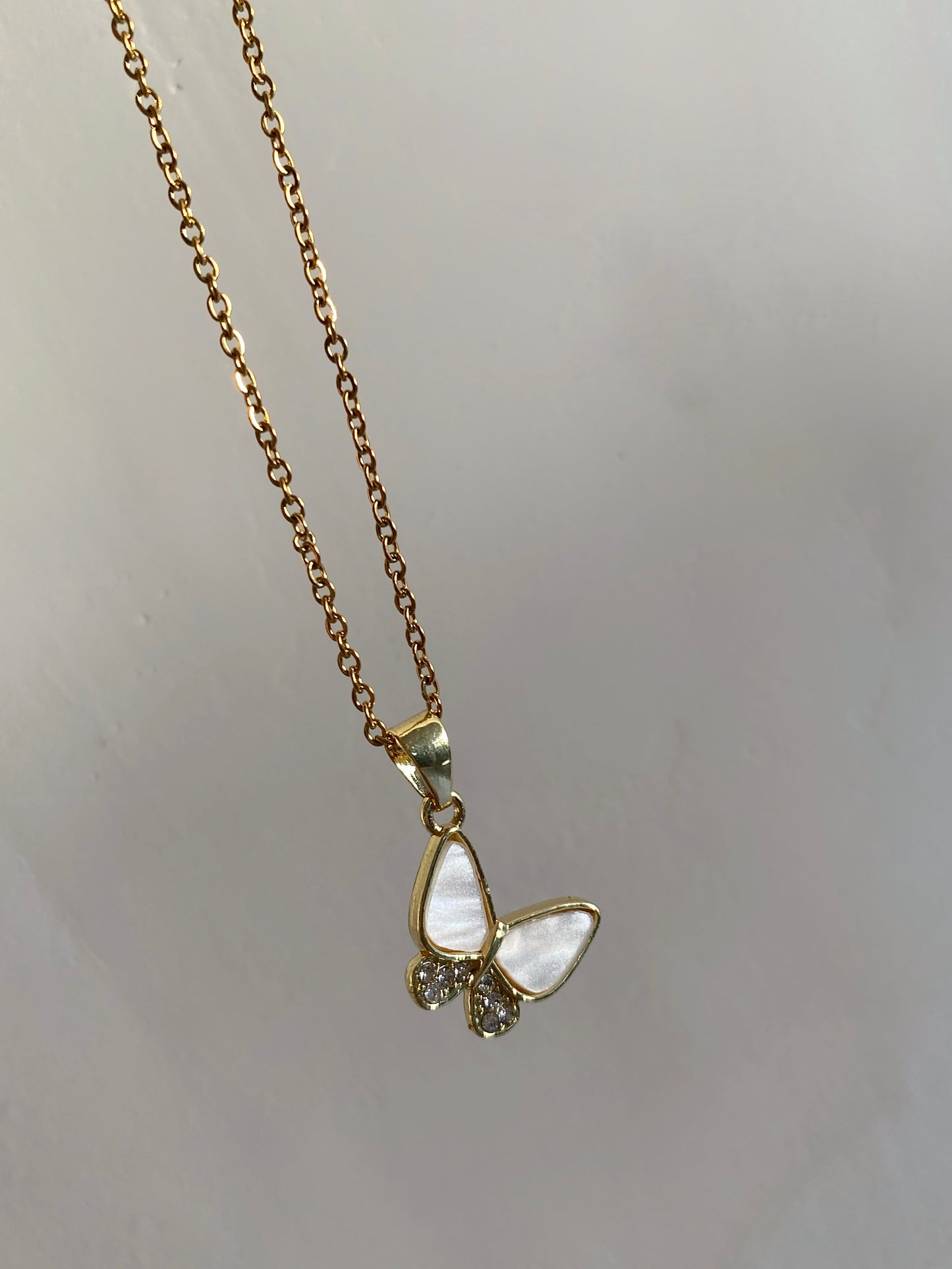 BUTTERFLY PLAYING ON A GOLDEN CHAIN - NECKLACE