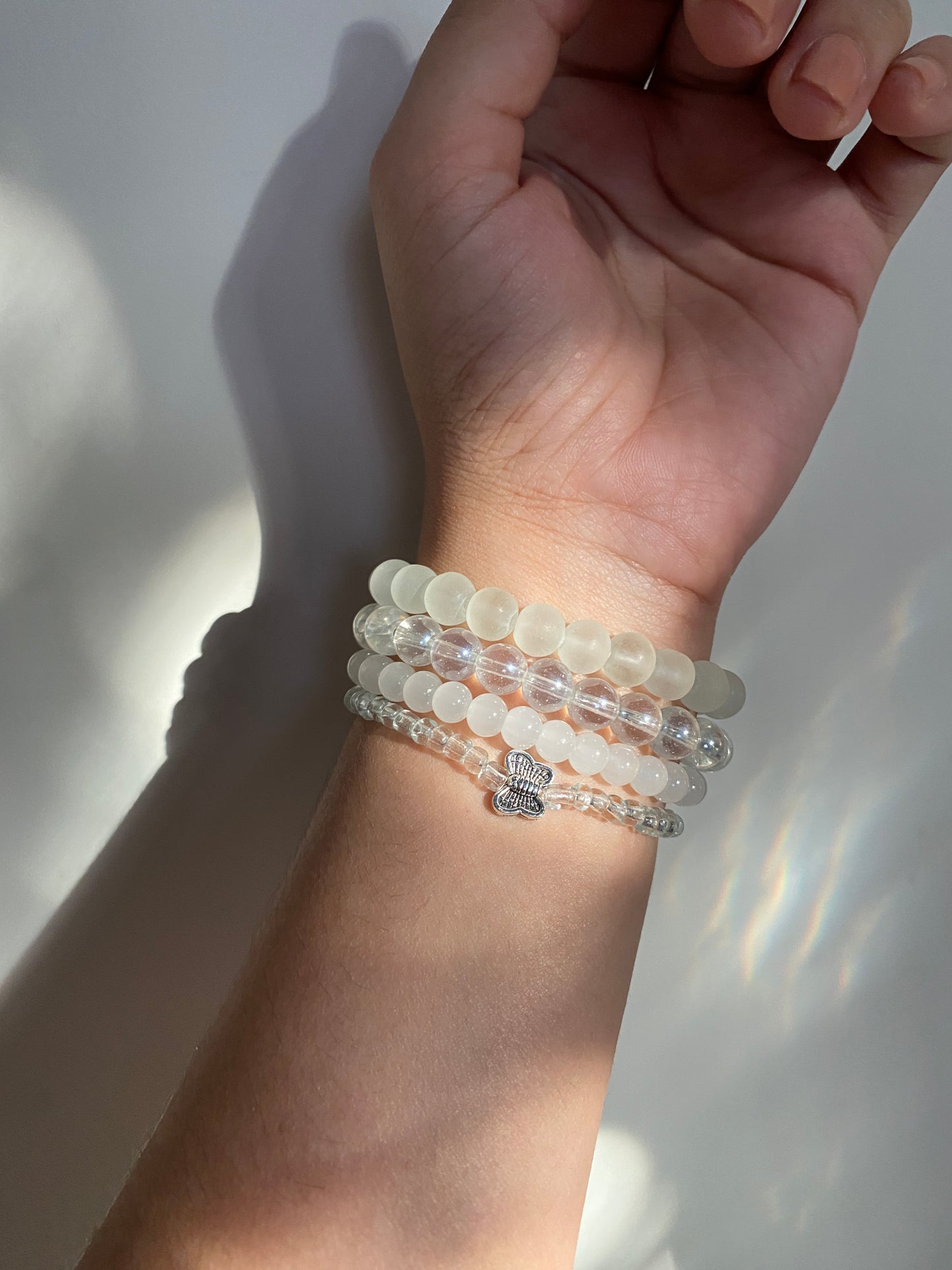 BUTTERFLY IN AN OCEAN OF PEARLS - STACK OF FOUR BRACELETS