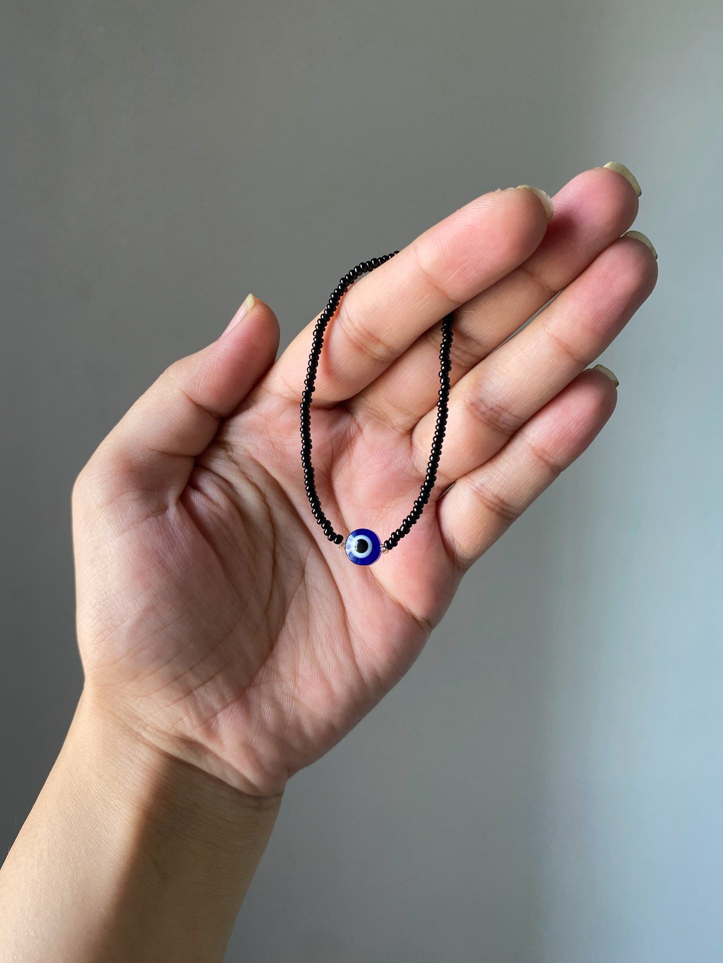 MINIMAL BLACK BEADED EVIL EYE BRACELET