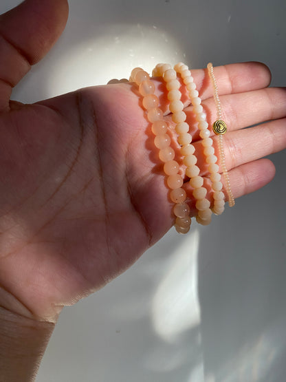 NUDE STACK OF FOUR BRACELETS