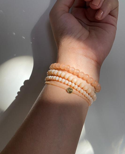 NUDE STACK OF FOUR BRACELETS