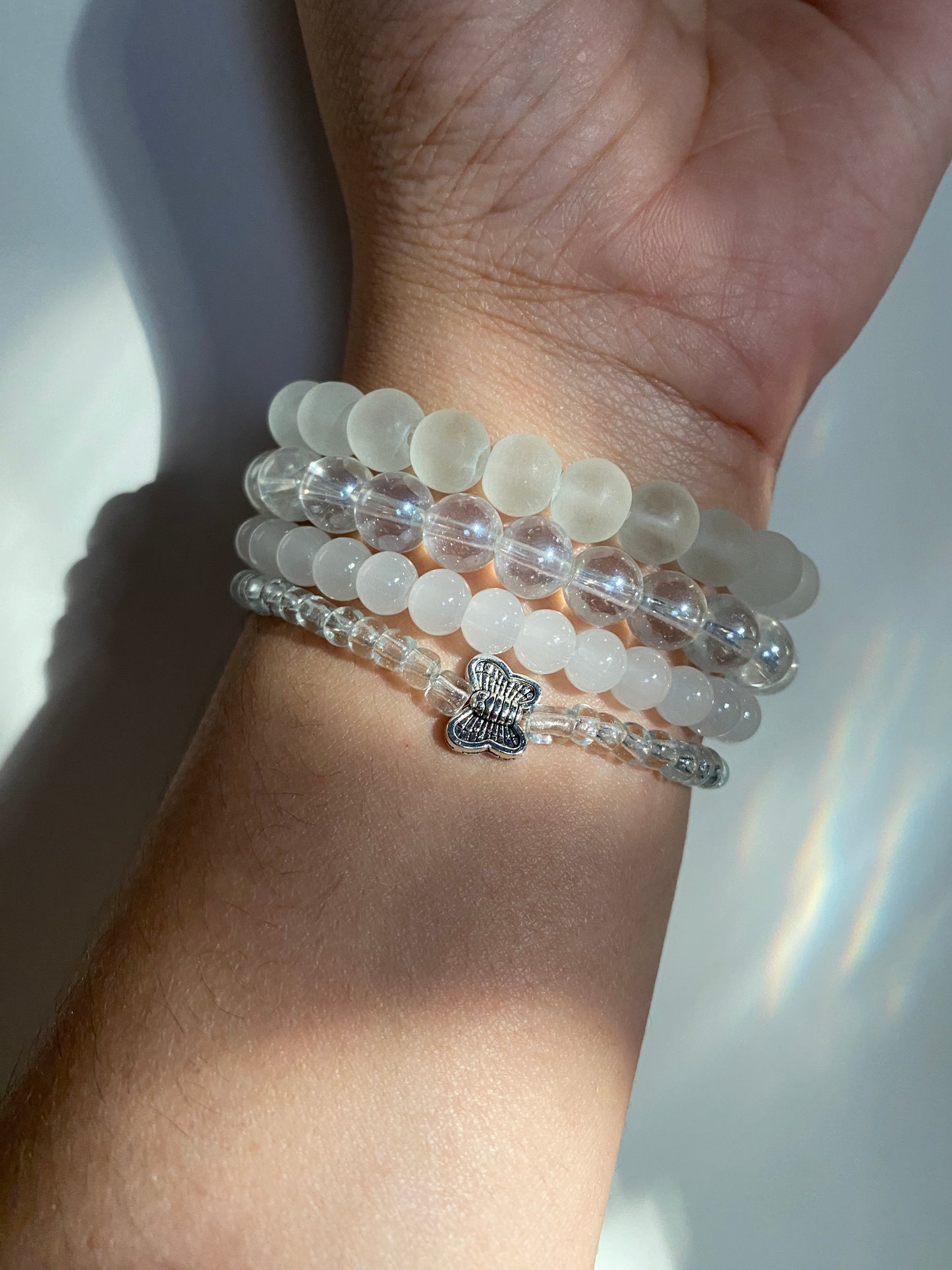 BUTTERFLY IN AN OCEAN OF PEARLS - STACK OF FOUR BRACELETS