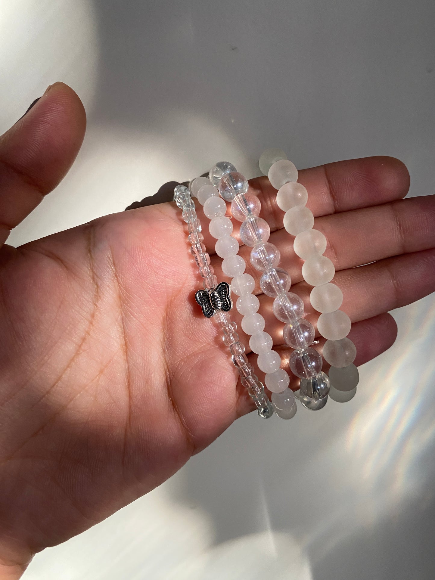 BUTTERFLY IN AN OCEAN OF PEARLS - STACK OF FOUR BRACELETS