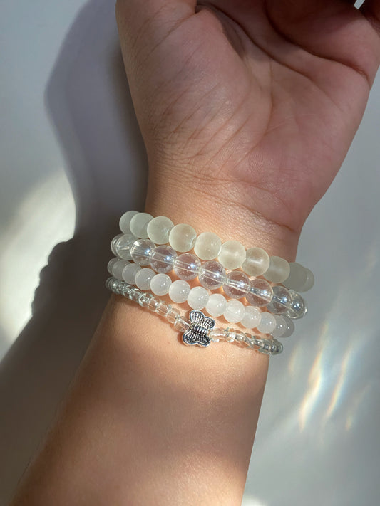 BUTTERFLY IN AN OCEAN OF PEARLS - STACK OF FOUR BRACELETS