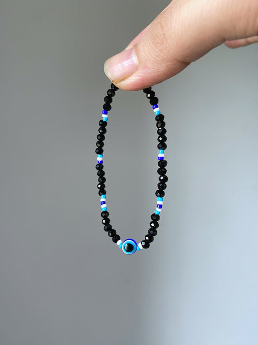 BLACK CRYSTAL EVIL EYE BRACELET