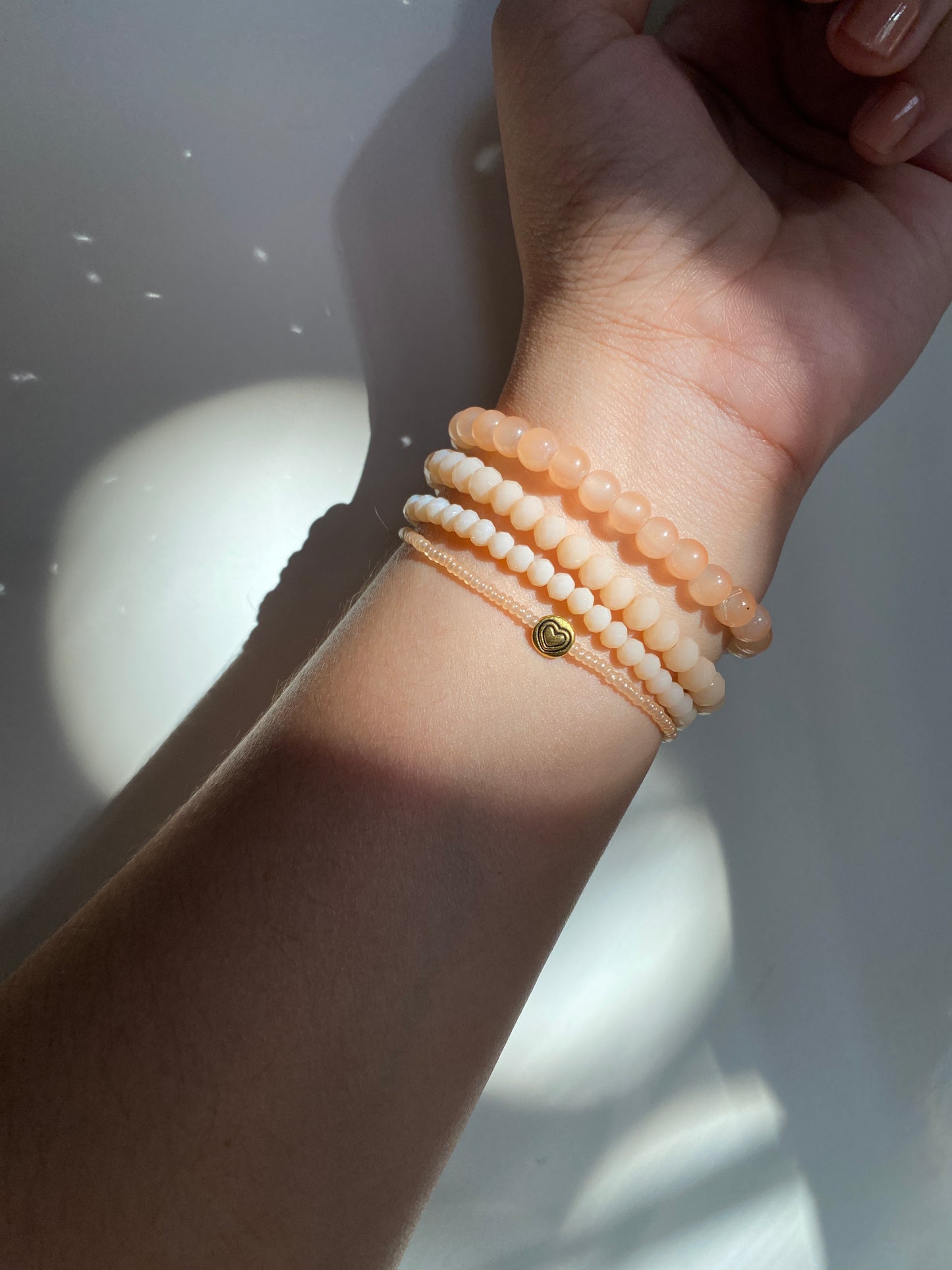 NUDE STACK OF FOUR BRACELETS